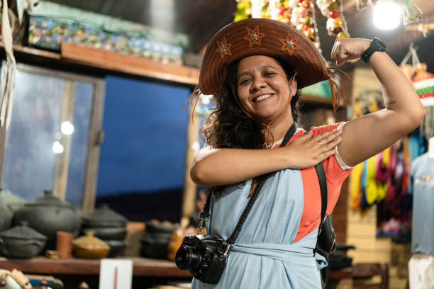 Northeastern woman wearing cangaceiro hat Northeastern woman wearing cangaceiro hat in Olinda, Pernambuco, Brazil. brazilian culture stock pictures, royalty-free photos & images