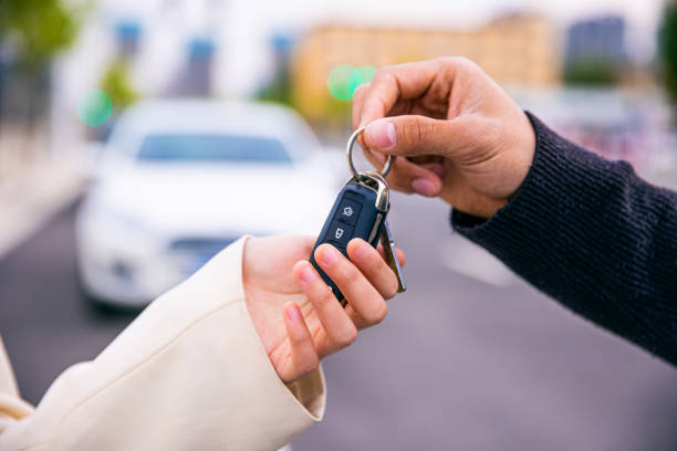 Your new car key Your new car key passing giving stock pictures, royalty-free photos & images