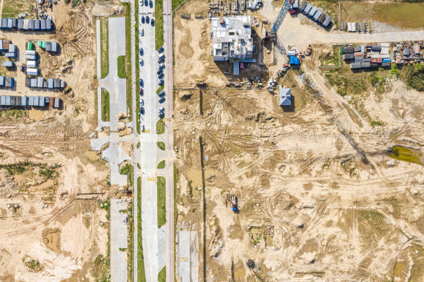 istock tower cranes and multistory apartment building under construction. aerial top view 1313215634