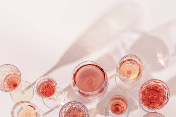 istock Rose wine assortment in crystal glasses, rose champagne sparkling wine with daylight shadows. Summer alcoholic drink 1313216607