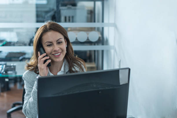 istock Woman working in an office with her desktop computer 1313221722