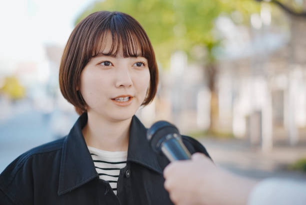 istock Young woman interviewed on the street 1313222719