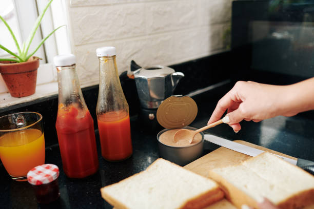 istock Woman making breakfast sandwiches 1313222773