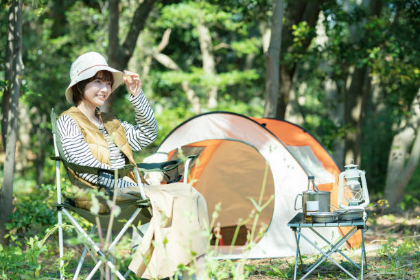 istock A young woman relaxing in front of a tent 1313224567