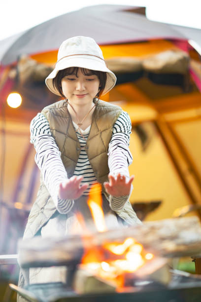 istock A woman enjoying a bonfire 1313225229