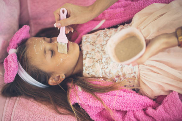 istock Little girl having a treatment for face. 1313226272