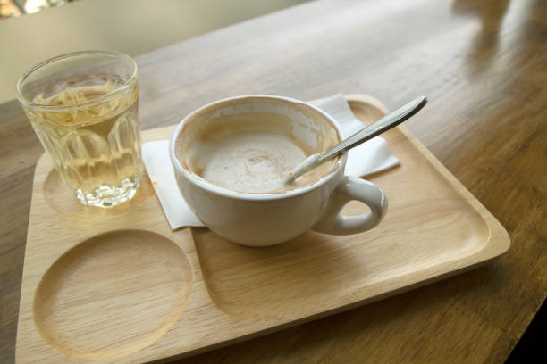 istock Hot coffee in a cup and tea mug on a wooden table 1313226309