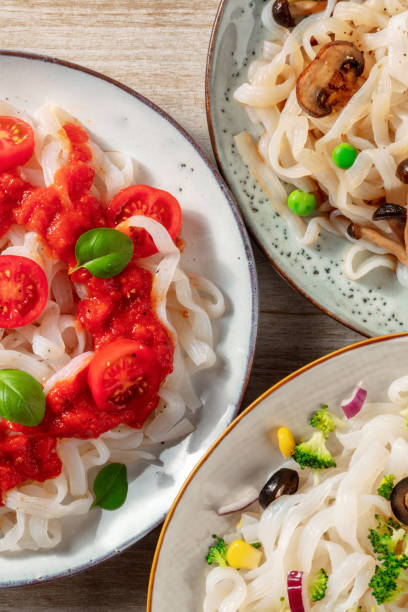 istock Konjac pasta with vegetables close-up, various plates 1313227212