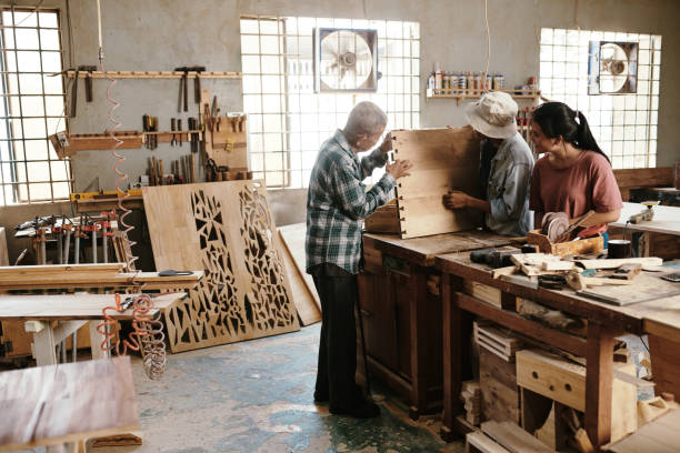 istock Carpenter examining finished wooden board 1313229122
