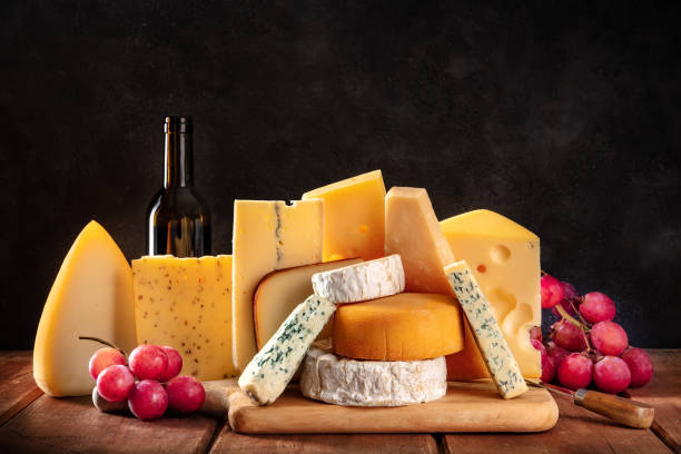 istock Cheese, fruit, and wine. A selection of various cheeses, side view 1313231603