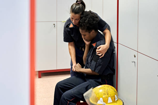 istock Mid Adult Female Firefighters Coping with Emotional Stress 1313232201