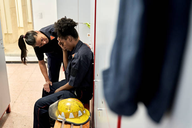 istock Female Firefighter Giving Emotional Support to Teammate 1313232205