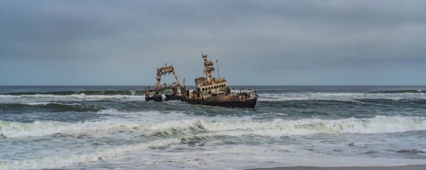 istock Skeleton Coast in Namibia. The shipwreck was stranded or grounded at the coastline 1313232645
