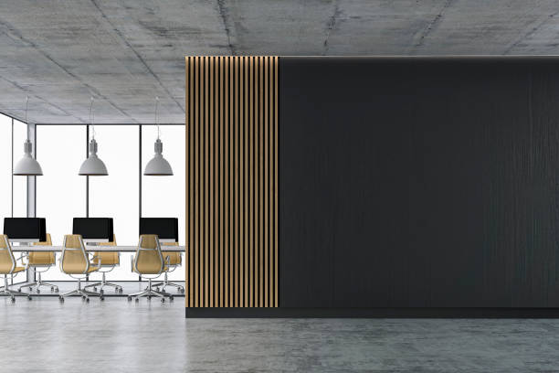 istock Empty office interior with copy space and wordesks on concrete floor 1313234290