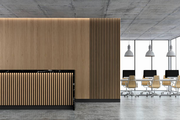 istock Empty office interior with copy space, wordesks and reception desk on concrete floor 1313234295