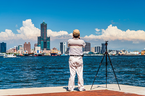 Tourists admire the scenery and take photos in the port of Kaohsiung, Taiwan.