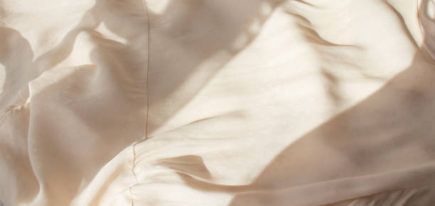 istock Abstract beige background flat layout. Modern minimalistic background with crumpled fabric texture and cotton folds. Top view for presentation 1313234703