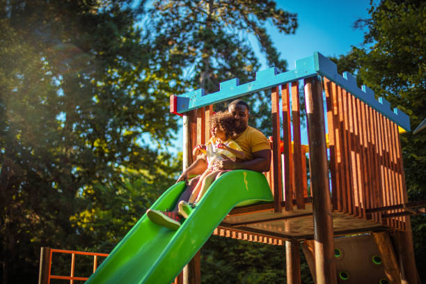 istock African American father having fun outdoors with his daughter. 1313235517