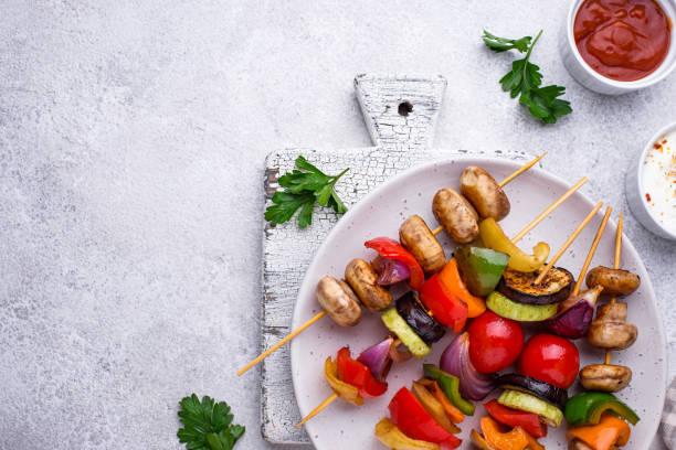 istock Vegetarian skewers with different grilled vegetables. 1313235829
