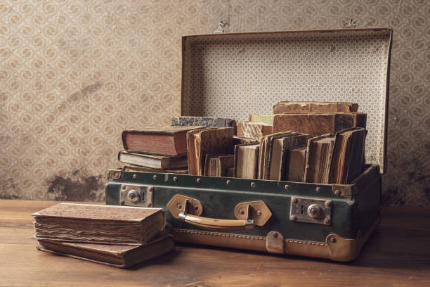 istock Old suitcase full of vintage books 1313236856