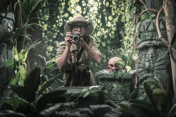 istock Brave explorer shooting pictures in the tropical forest 1313238727