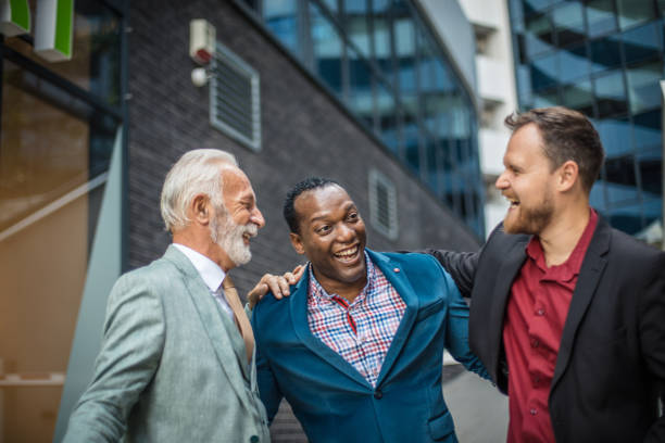 istock Perfect day for colleagues. Three business men talking. Focus is on background. 1313241213