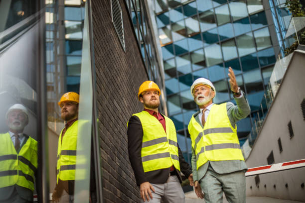 istock There was a problem on the construction site. Mature engineer discussing the structure of the building with architects colleague at construction site. 1313241214