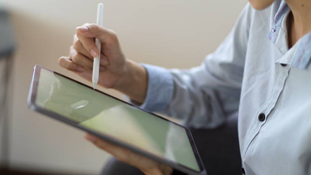 istock Close up view of female working on her project with digital tablet 1313242123