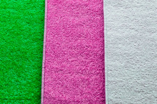 textile pile mats of different colors. front view, indoors horizontal shot. - wiping feet imagens e fotografias de stock