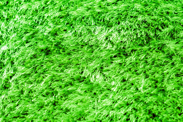 green textile pile mats of different colors. close up. front view, indoors horizontal shot. - wiping feet imagens e fotografias de stock