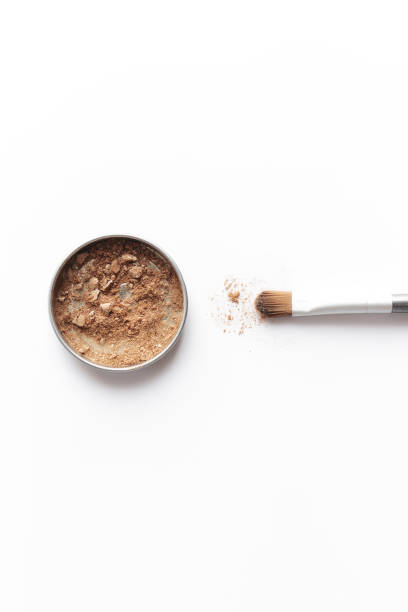 istock Light brown face shadow in container and eye shadow or make-up brush 1313243682
