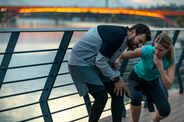 istock Young Man Suffered a Knee Injury During Morning Exercise with his Girlfriend 1313245179