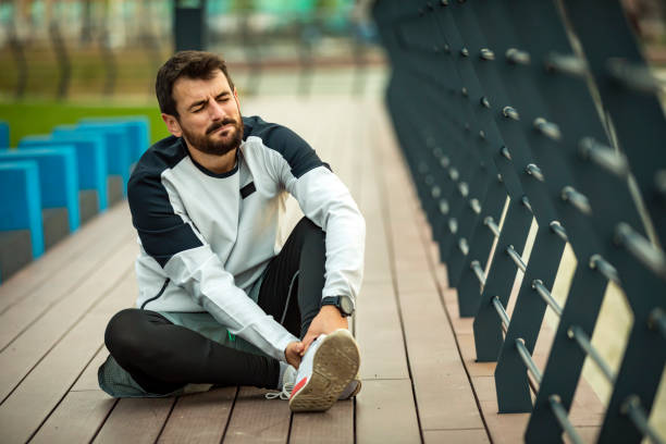 istock Young Man Suffered an Ankle Injury During Morning Exercise 1313245531