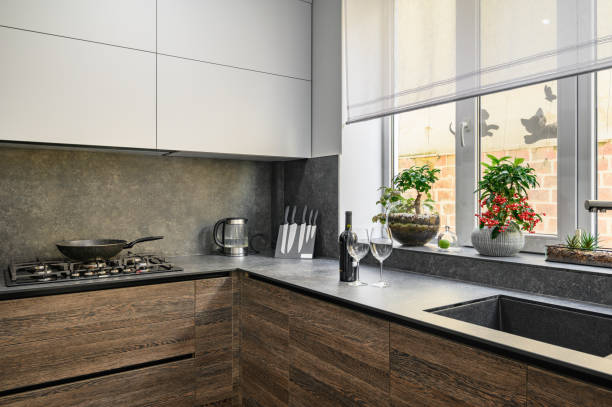 istock Modern luxury large dark brown, gray and black kitchen details 1313246712