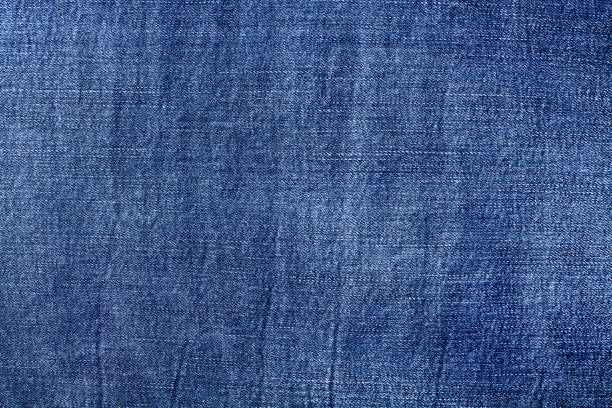 istock Blue jeans texture closeup, jean textile background, dark blue color denim backdrop, jeans pattern design, indigo cotton jeans cloth, fabric, material, fiber, blank frame, wallpaper, empty copy space 1313250929