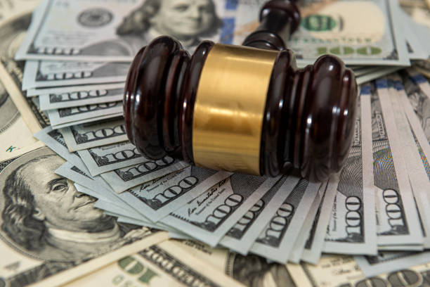 istock dollar money and judges gavel on table 1313255725