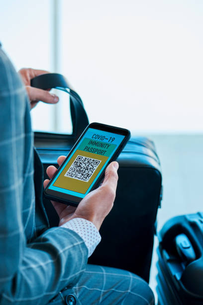 istock man has a covid-19 immunity passport in his phone 1313256002