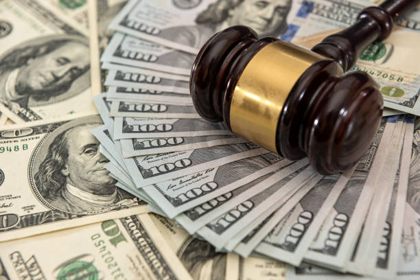 Wooden judge gavel and us money dollar bills Wooden judge gavel and us money dollar bills. Bribe concept pictures of divorce papers stock pictures, royalty-free photos & images