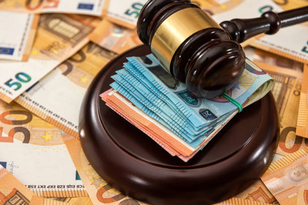 istock Judge hammer on 50 Euro banknotes background 1313256817