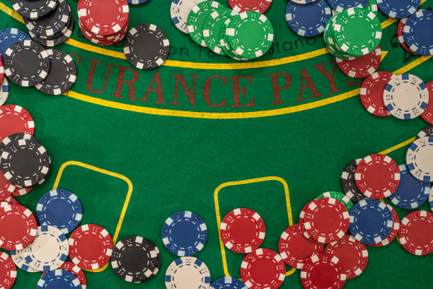 istock Gambling chips on green table in casino 1313257243