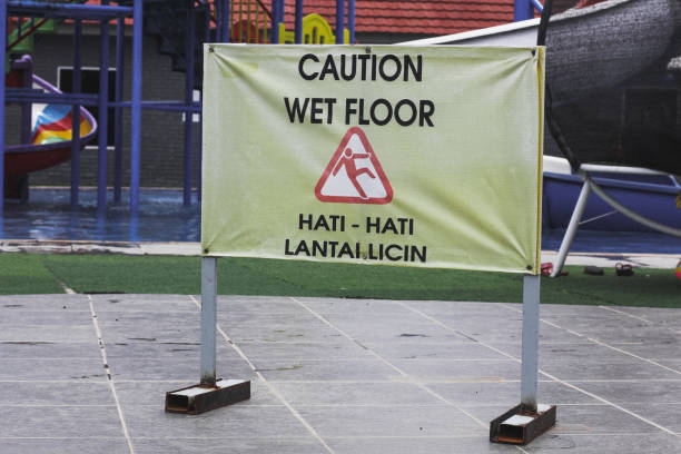 istock wet floor sign on the swimming pool 1313257461