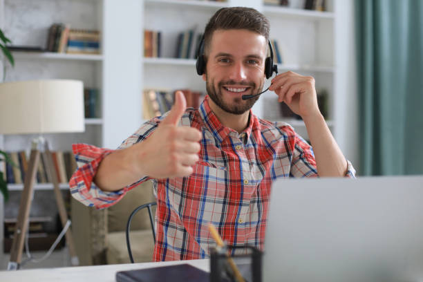 istock Businessman showing OK sign with his thumb up. Selective focus on face. 1313258090