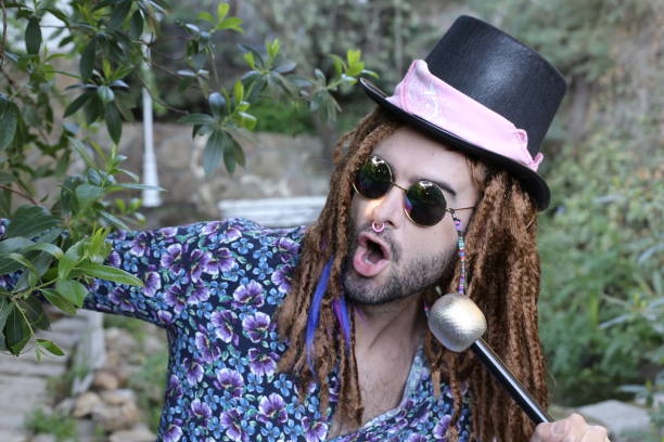 istock Singer with alternative style holding microphone 1313258625