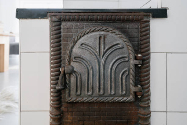 istock Cast iron firebox door on wood burning stove 1313258723