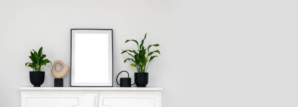istock Houseplants and home decor on shelf above fireplace 1313258807