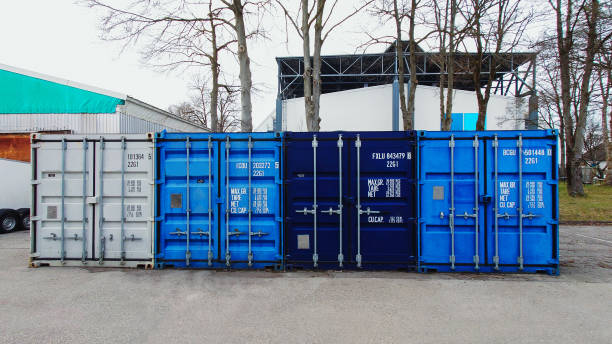 istock Transport containers stand in a row 1313259424