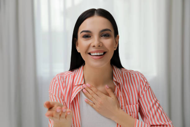 istock Beautiful young woman conducting webinar in room, camera view 1313261380