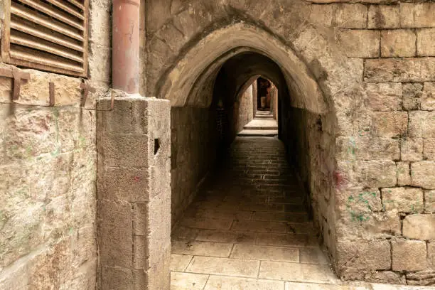 Tunnel passage under residential buildings in the Muslim quarter near the exit from the Temple Mount - Chain Gate, in the old city of Jerusalem, in Israel