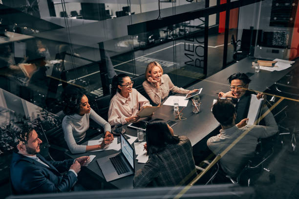 istock Young successful business team working in a spacious beautiful office communicating and discussing work. Concept of business, finance, strategy, management, advertising, planning. 1313264834