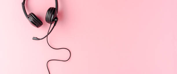 istock Customer service headset on pink background. Call center concept. Banner 1313265414